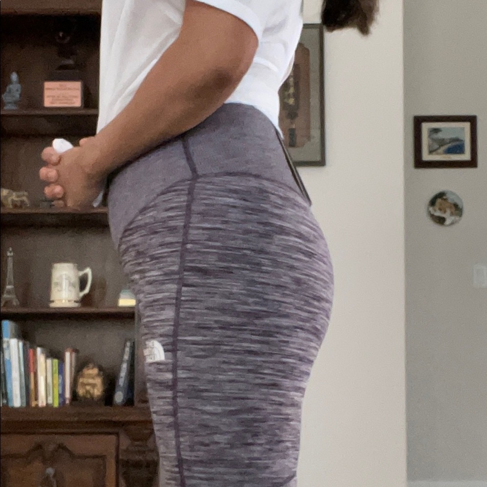 The North Face leggings, size small. Maroon pattern material design